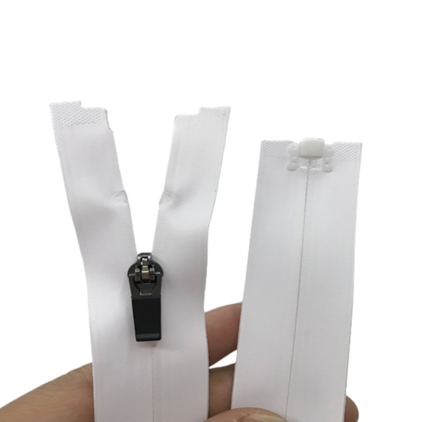 A white zipper with a black pull tab