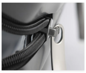 Close-up of a zipper on a suitcase showing the zipper puller and secure closure mechanism