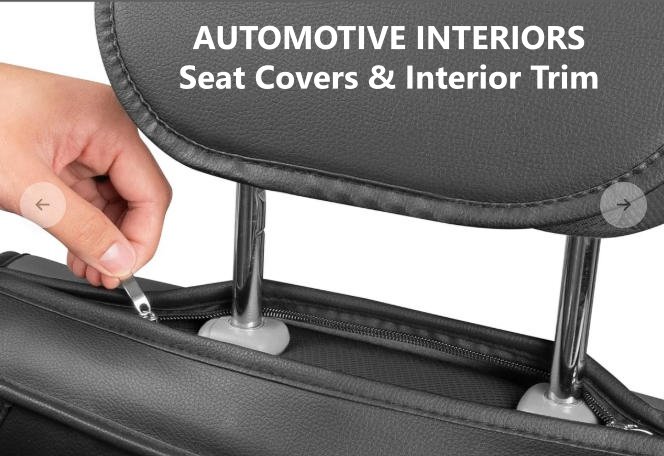 Fire retardant automotive interior zipper on black leather car seat cover, hand pulling zipper slider for auto trim cushion
